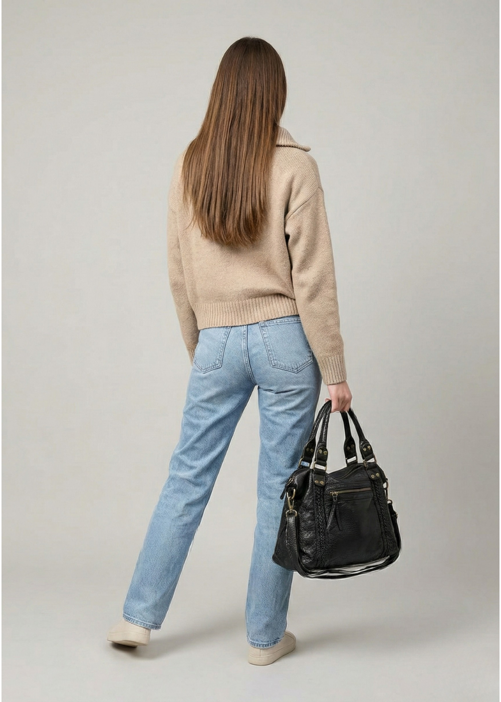 black handbag for school with an exterior zipper pocket